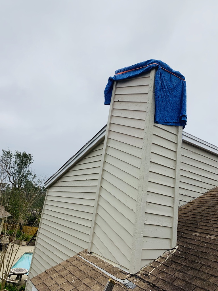 blue tarp on a Chimney Sweep Biloxi