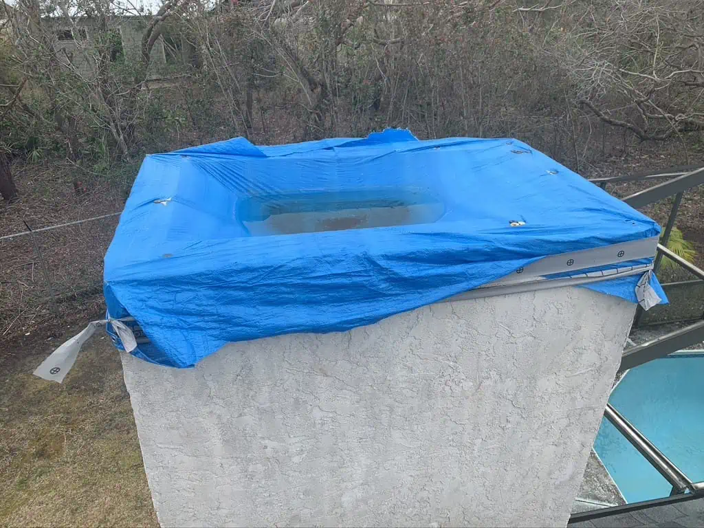 Blue tarp on a chimney