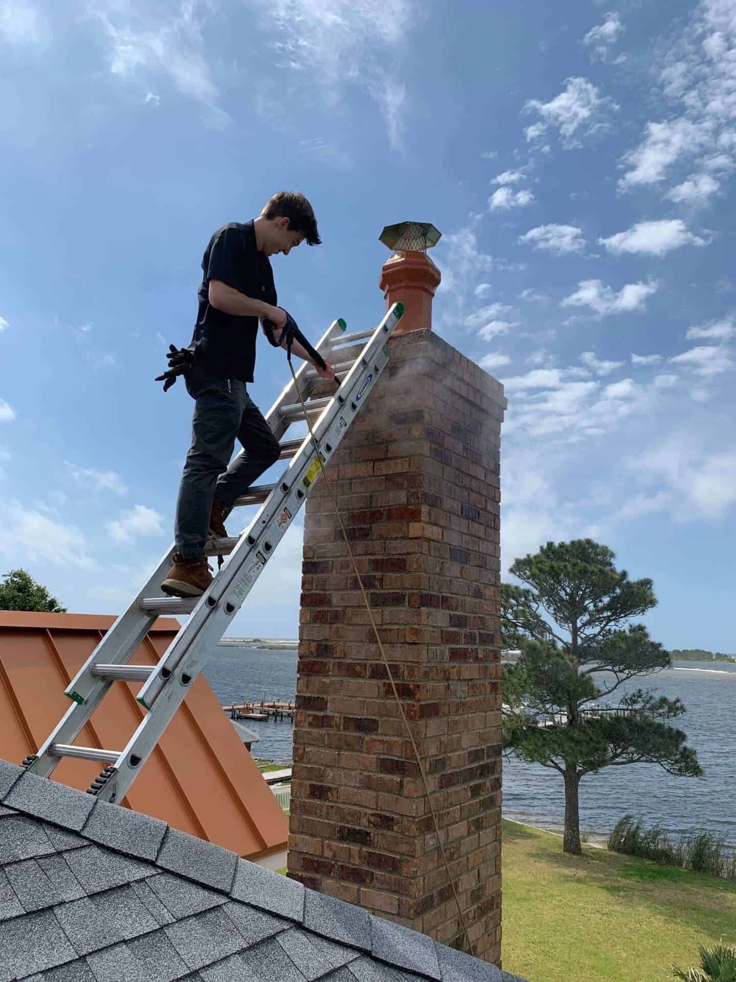 Allstar CHimney Tech sweeping chimney in Huntsville Alabama