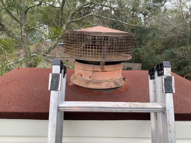 chimney repair on rusty cap